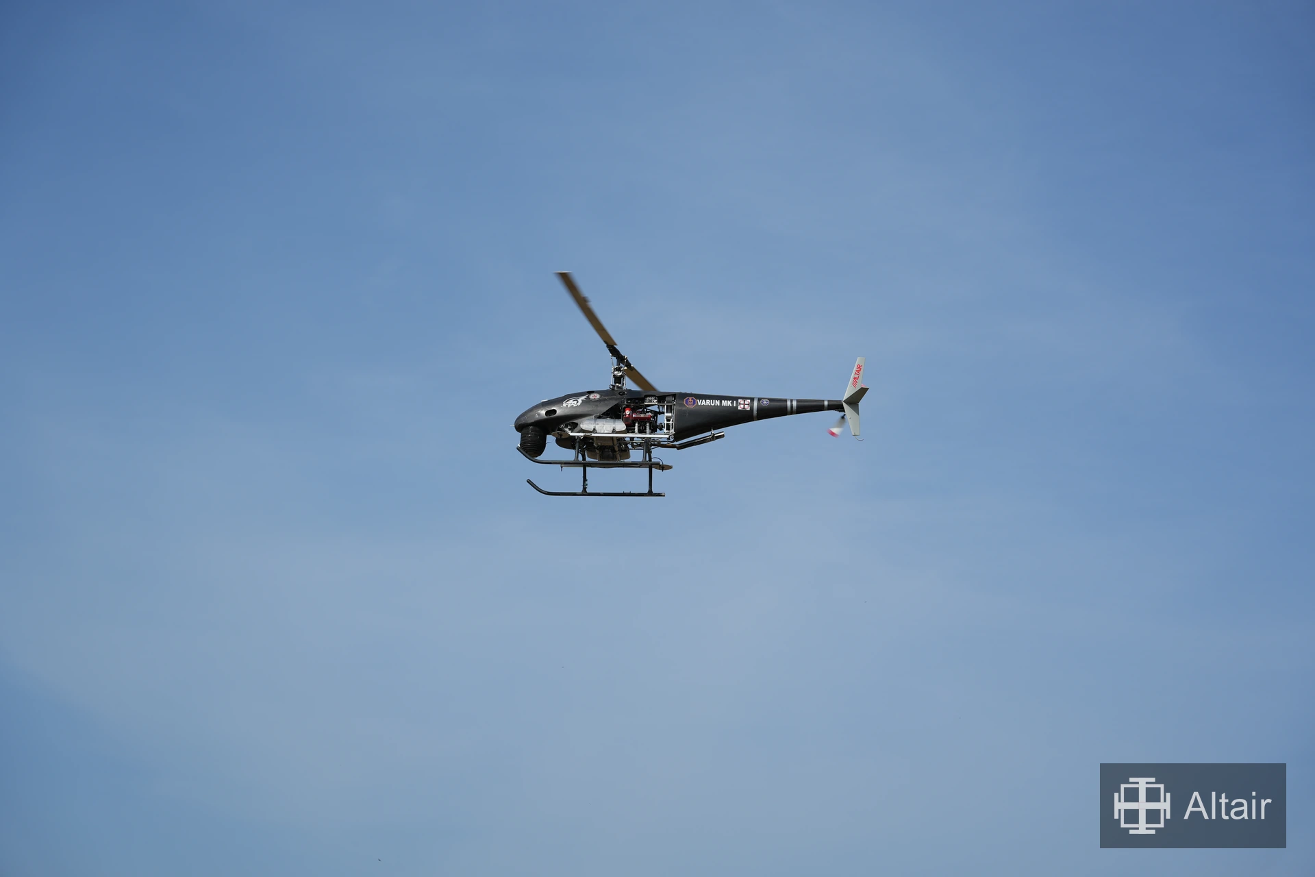 Altair VARUN MK I helicopter flying against a blue sky
